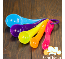 A set of 5 bright plastic measuring spoons