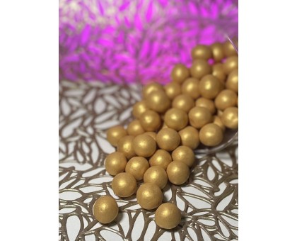Crispy cereal balls covered with milk chocolate, Gold (100 grams)