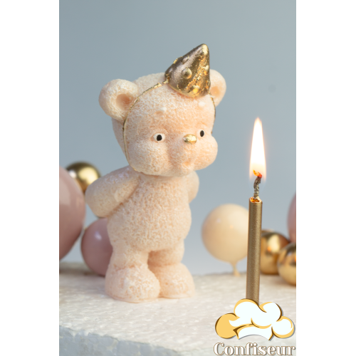 Шоколадна статуетка "Ведмедик персиковий золотий ковпак задуває свічку" зі свічкою