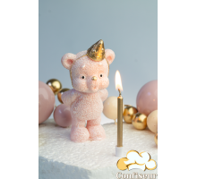 Шоколадна статуетка "Ведмедик рожевий золотий ковпак задуває свічку" зі свічкою