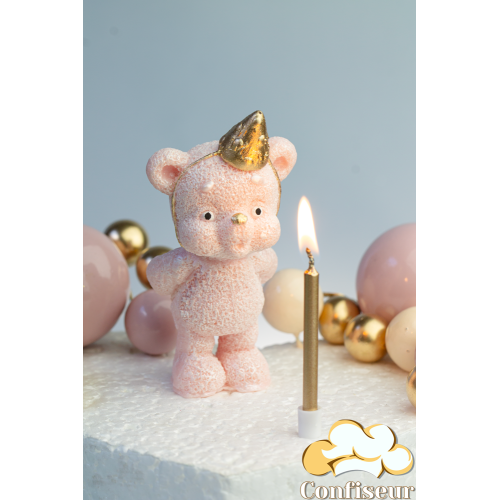 Шоколадна статуетка "Ведмедик рожевий золотий ковпак задуває свічку" зі свічкою