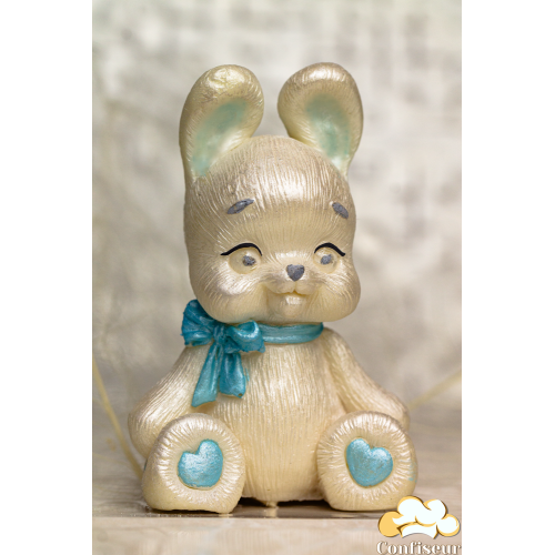 Шоколадна статуетка перламутрова "Зайченя" з блакитним бантиком Шоколадна статуетка перламутрова "Зайченя" з блакитним бантиком